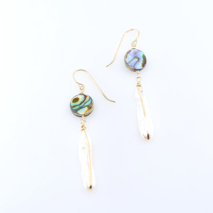 A pair of dangle earrings featuring round, iridescent green and blue Abalone and Biwa Pearl drops, shown on a clean white background.