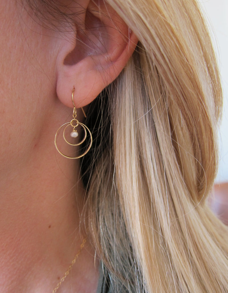 Forged double circle earring with pearl center