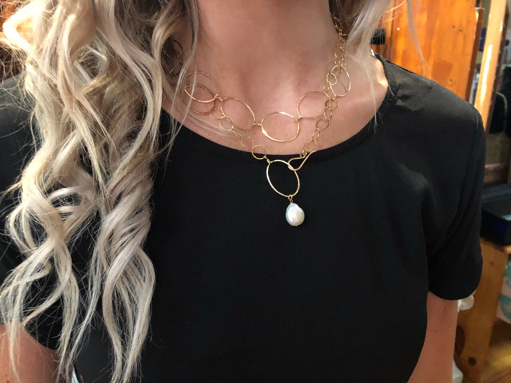 Model wearing 14k GF forged oval and chain necklace-36" length (shown styled as wrapped double around her neck)